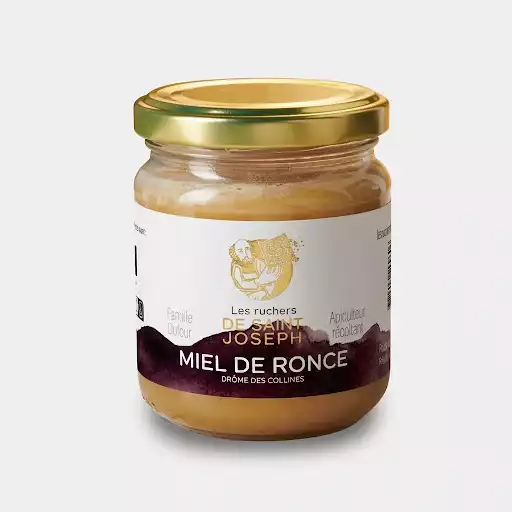 Pot de 250g de miel de ronce bio artisanal, récolté par la famille Dufour dans la Drôme.