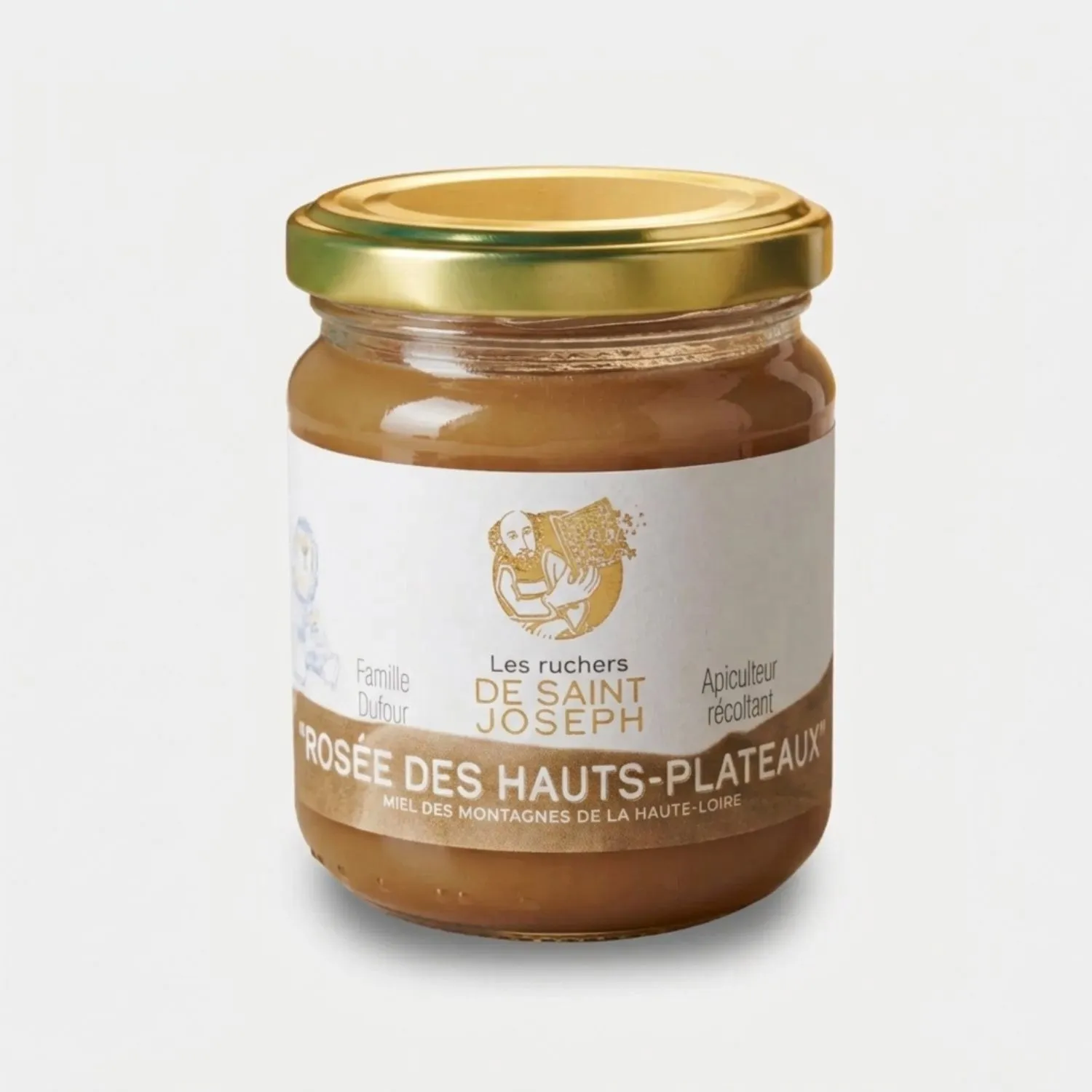 Pot de miel Rosée des Hauts-Plateaux (250g) Les Ruchers de Saint Joseph. Miel de montagne bio de Haute-Loire, récolté à plus de 1 200 m. Texture crémeuse, couleur beige doré.