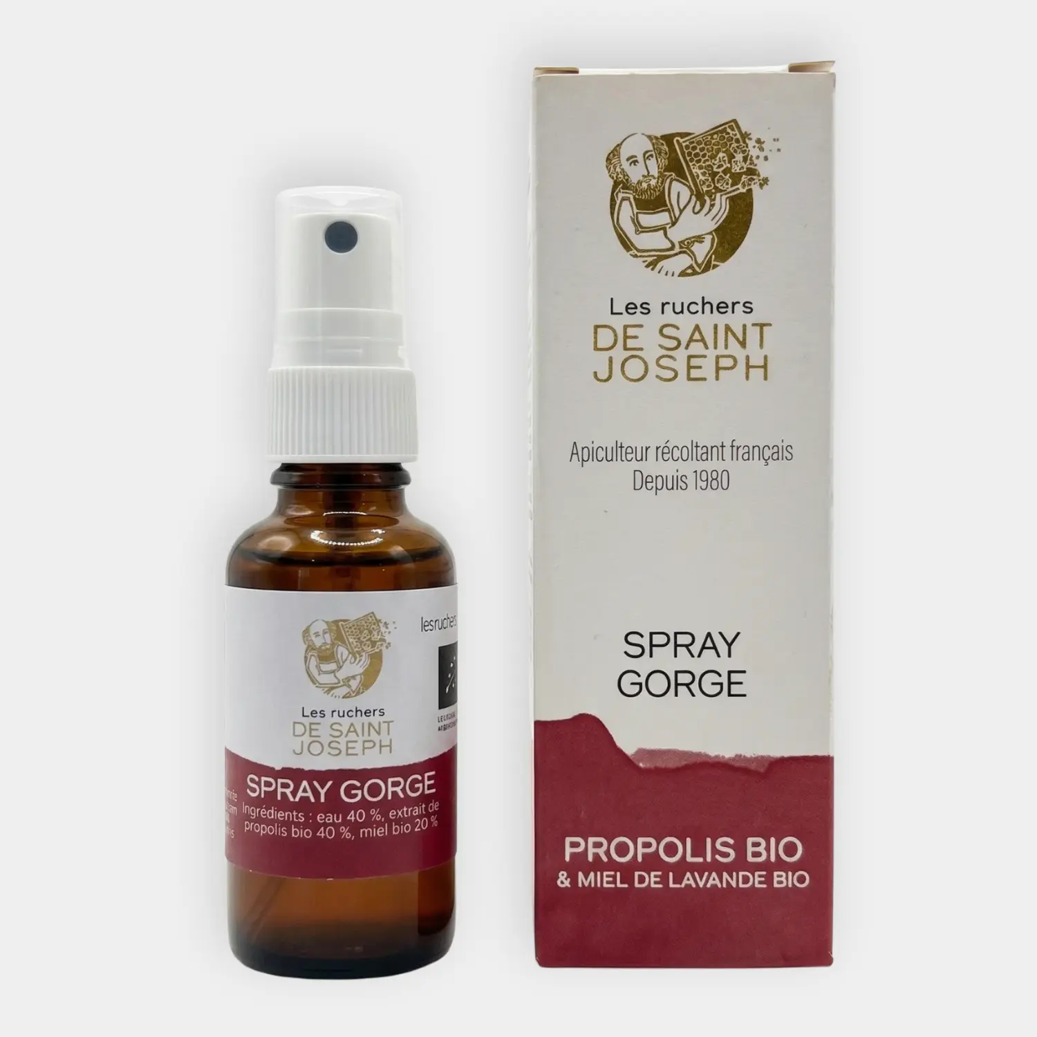 Flacon spray pour la gorge à la propolis bio et miel de lavande Les Ruchers de Saint Joseph. Présentation du flacon en verre ambré et de son étui en carton sur fond blanc avec labels bio.